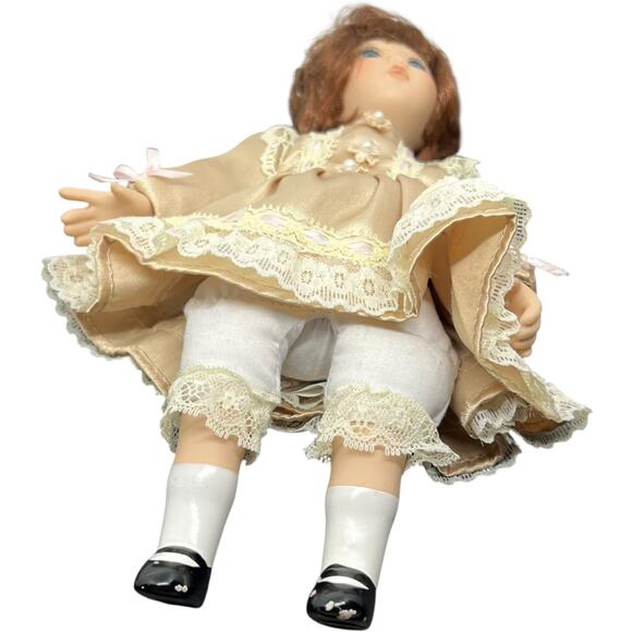 Porcelain Girl Doll in Champagne Satin Dress with Auburn Hair - Picture 4 of 11